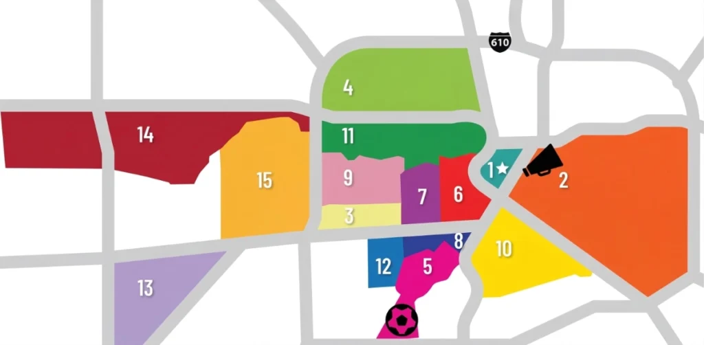 Un mapa urbano de alta resolución con una red de calles grises y 15 distritos distintos codificados por colores. Los distritos están numerados del 1 al 15. El distrito 1 tiene una estrella, el distrito 2 un megáfono y un balón de fútbol está debajo del distrito 5. El letrero de la carretera 610 es visible.
